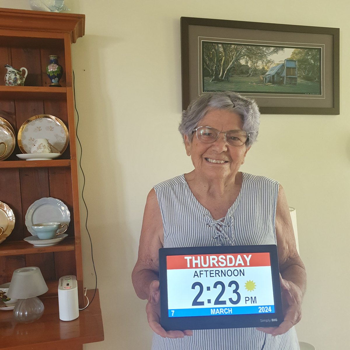 Customer holding the clock at home